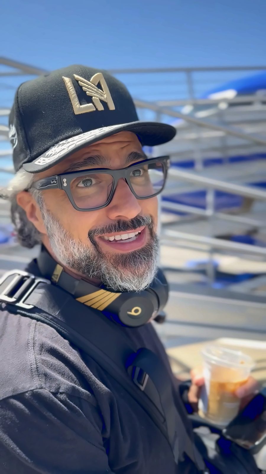 Jaime Camil laughs at the camera on the tarmac before his first Southwest flight