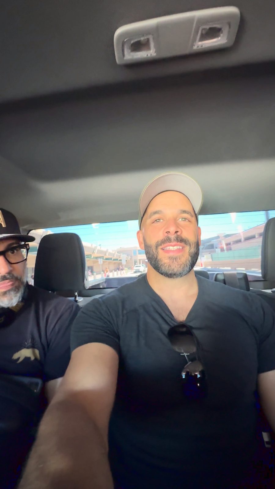 Selfie from the back of the fans’ SUV leaving Reno airport, with Jaime Camil in glasses and a cap behind