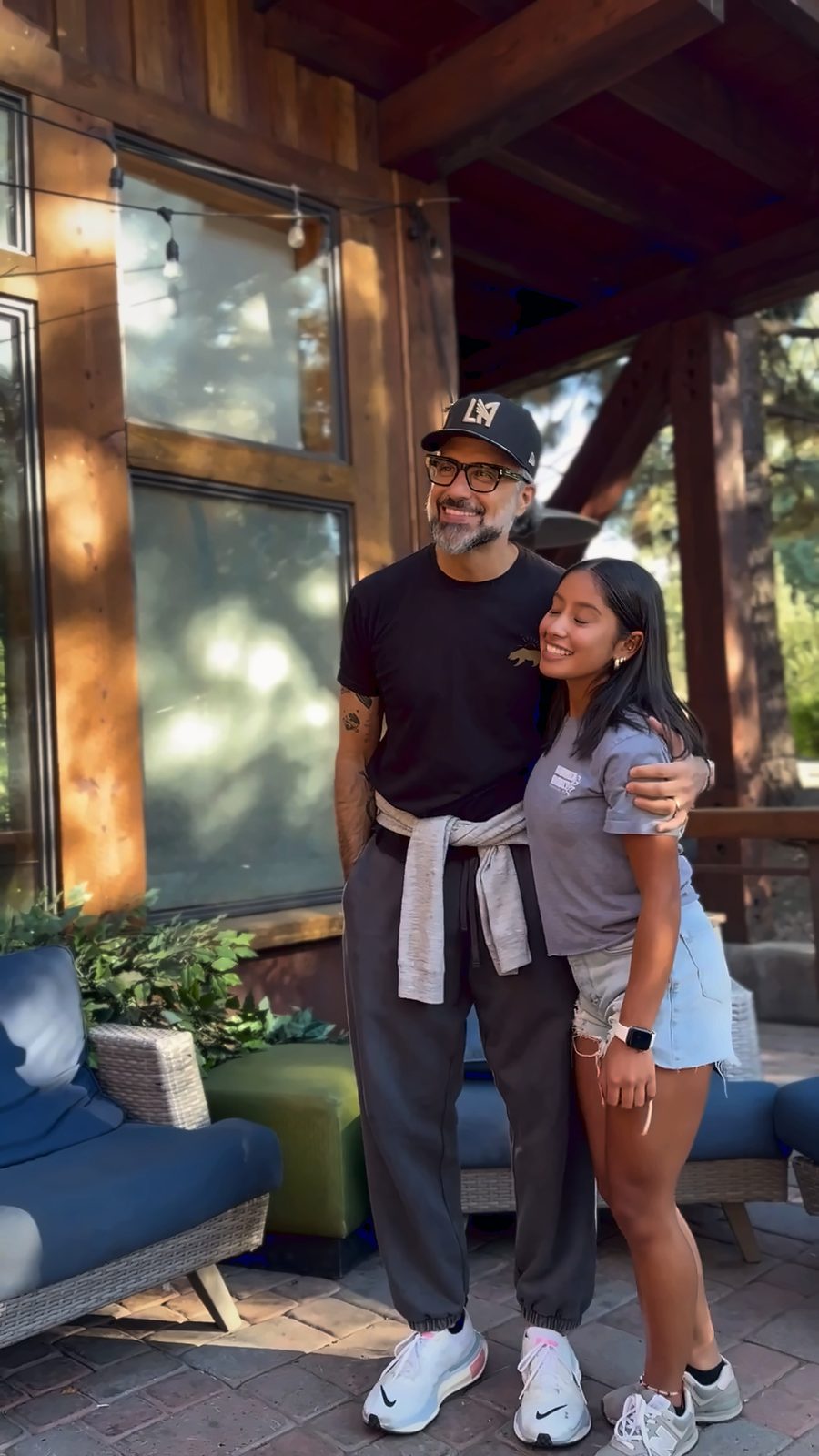 Jaime Camil poses for a photo with a fan on a restaurant patio in Truckee