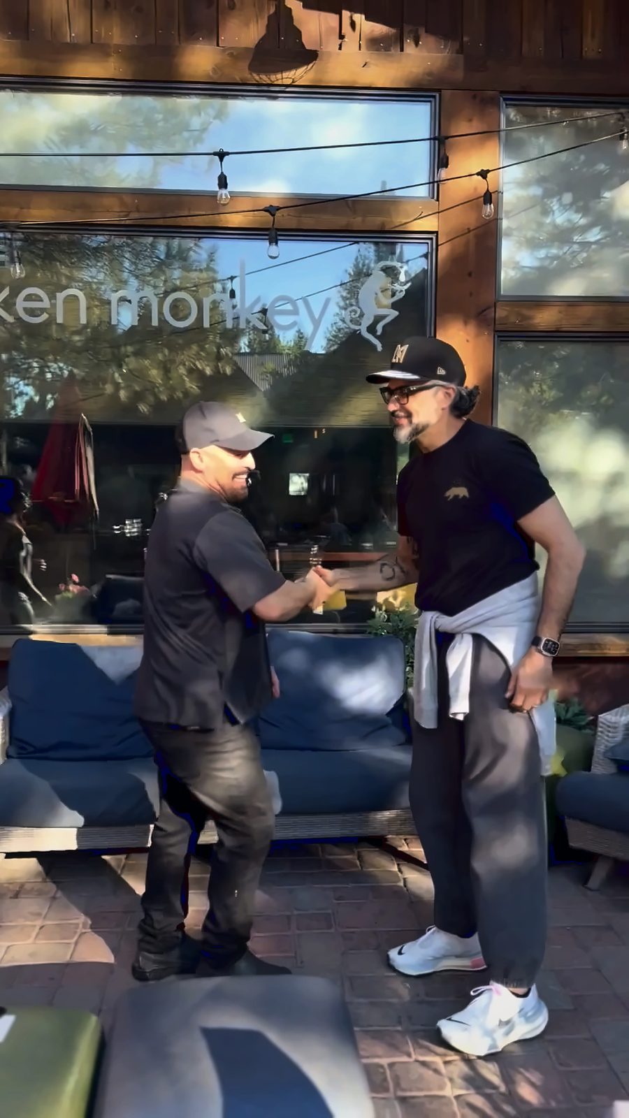 Jaime Camil, right, shakes hands with a fan in front of a restaurant in Truckee