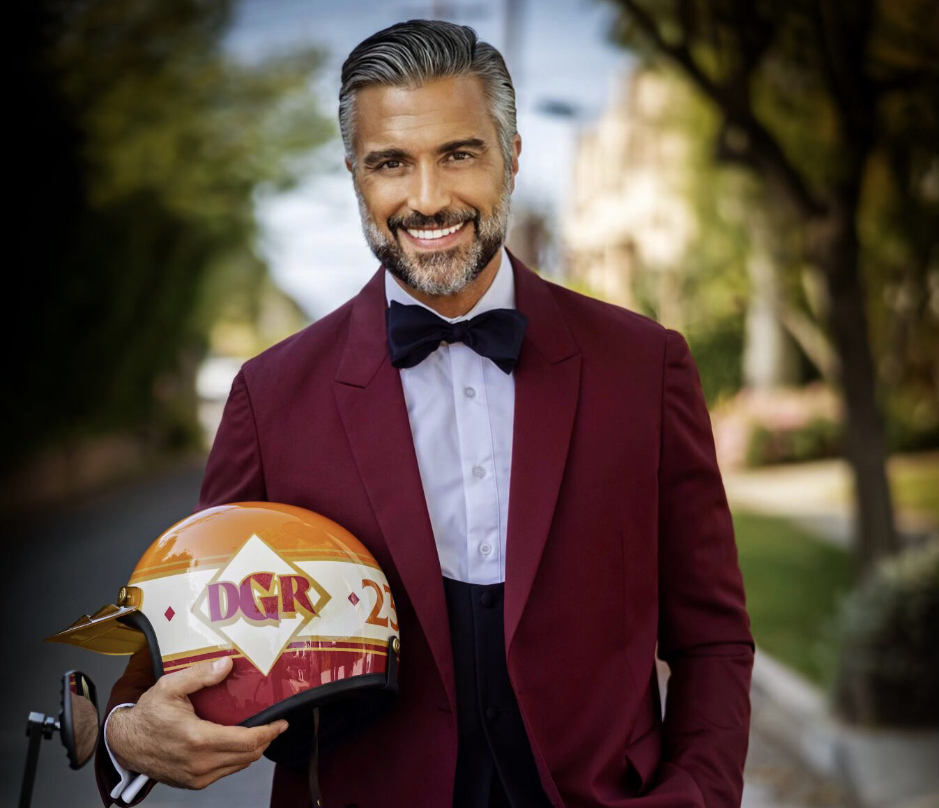 Jaime Camil holding a DGR helmet; portrait courtesy of The Distinguished Gentleman’s Ride